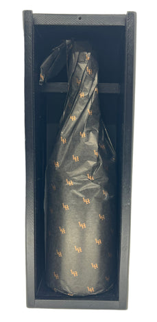 Black umbrella with gold patterns in a black box on a light gray background