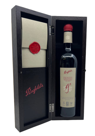 Penfolds wine bottle in a wooden box with a red wax seal on a white background