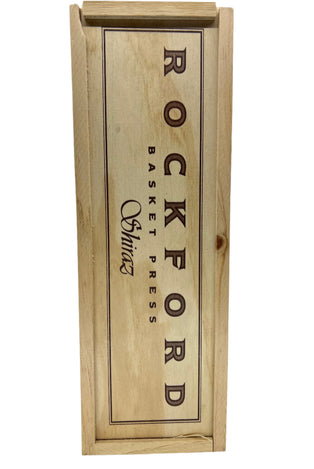 Wooden wine bottle label with 'Rockford Basket Press Shiraz' text on a white background