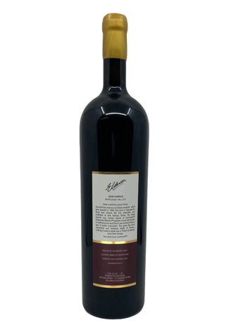 Wine bottle with a label on a white background