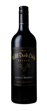 Wine bottle with 'Wild Duck Creek Estate' label on a dark background