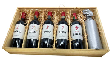 Six bottles of Z Force wine in a wooden box with decorative straw and ribbons.