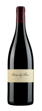 Red wine bottle with a label on a black background